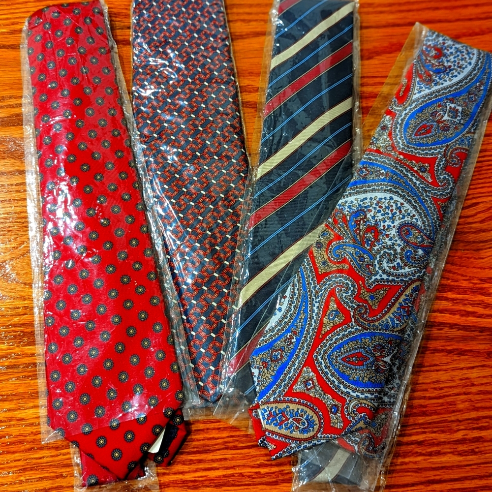 Four silk ties. All red and blue colors in different patterns